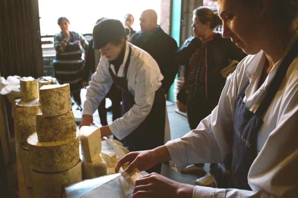 Cheeses being wrapped at our Spa Terminus market shop in Bermondsey