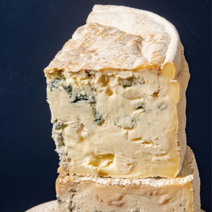 A close up of a piece of Pevensey Blue, showing the mottled paste with dark blue veining